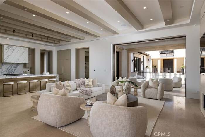 Open-plan great room with dining area and lounge seating