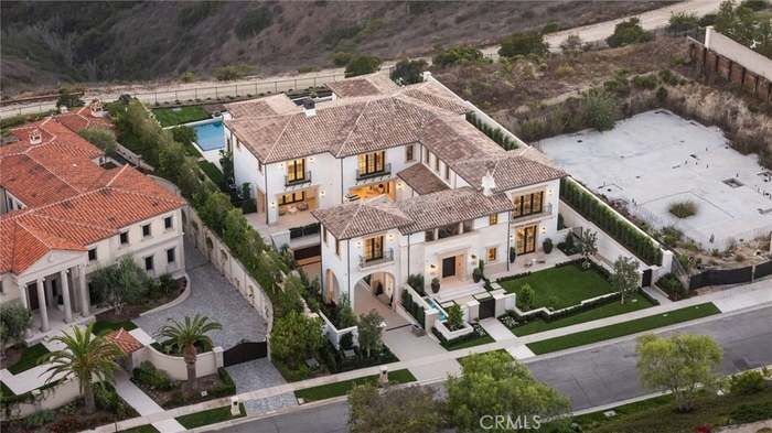 Aerial view of a residence and landscaped grounds