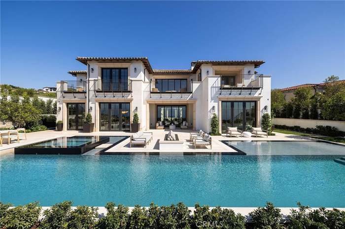 The residence and pool at 18 Swimmers Point in daylight